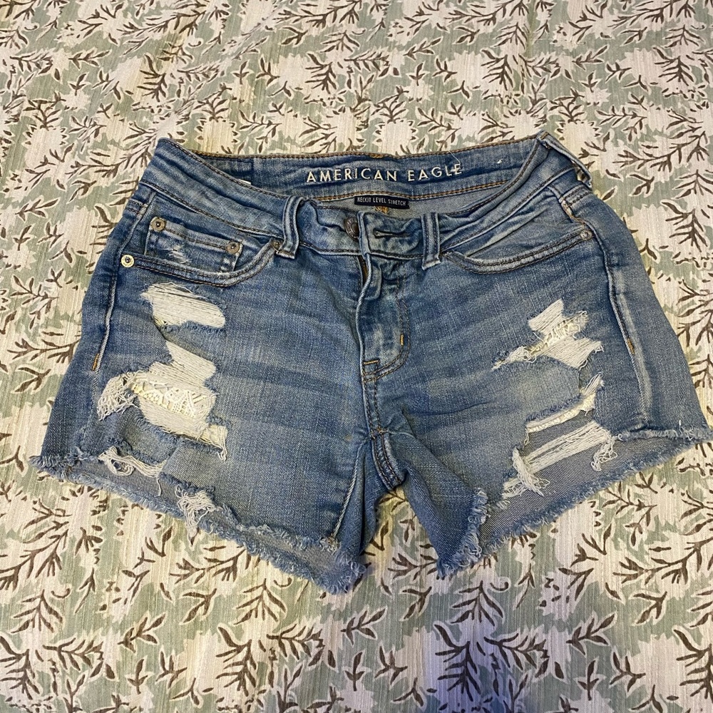 American Eagle low rise distressed lace Jean shorts